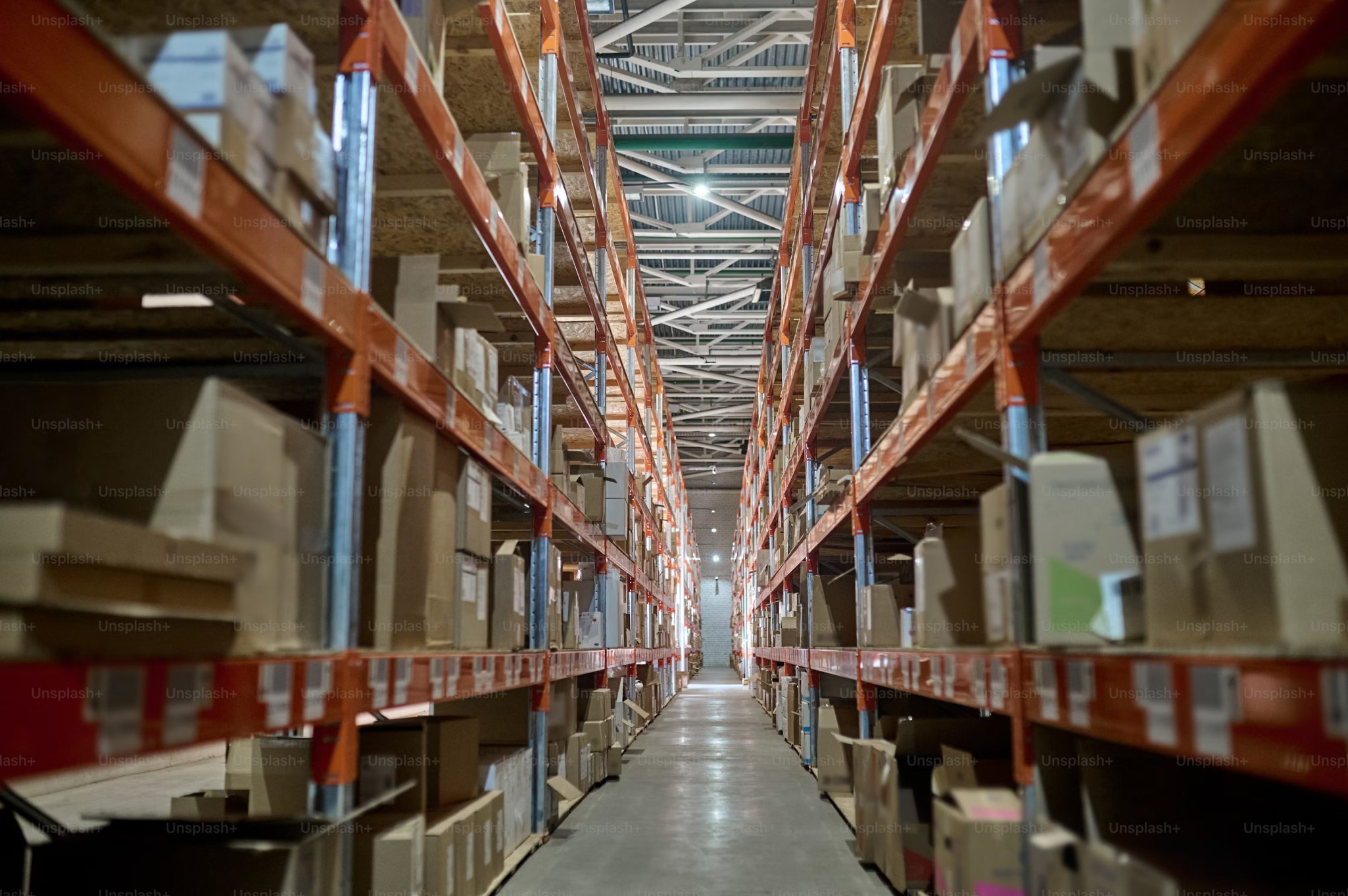 Interior of a spacious pick and pack warehouse with high shelves